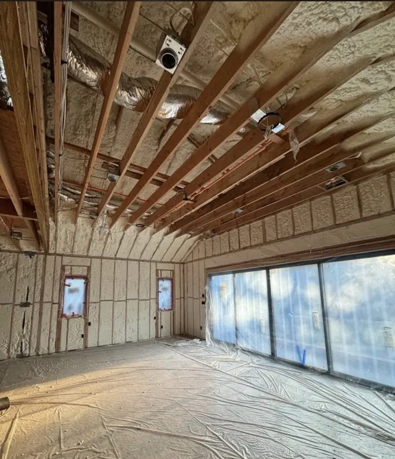 Interior walls and ceiling insulated with spray foam during new construction in East Hampton